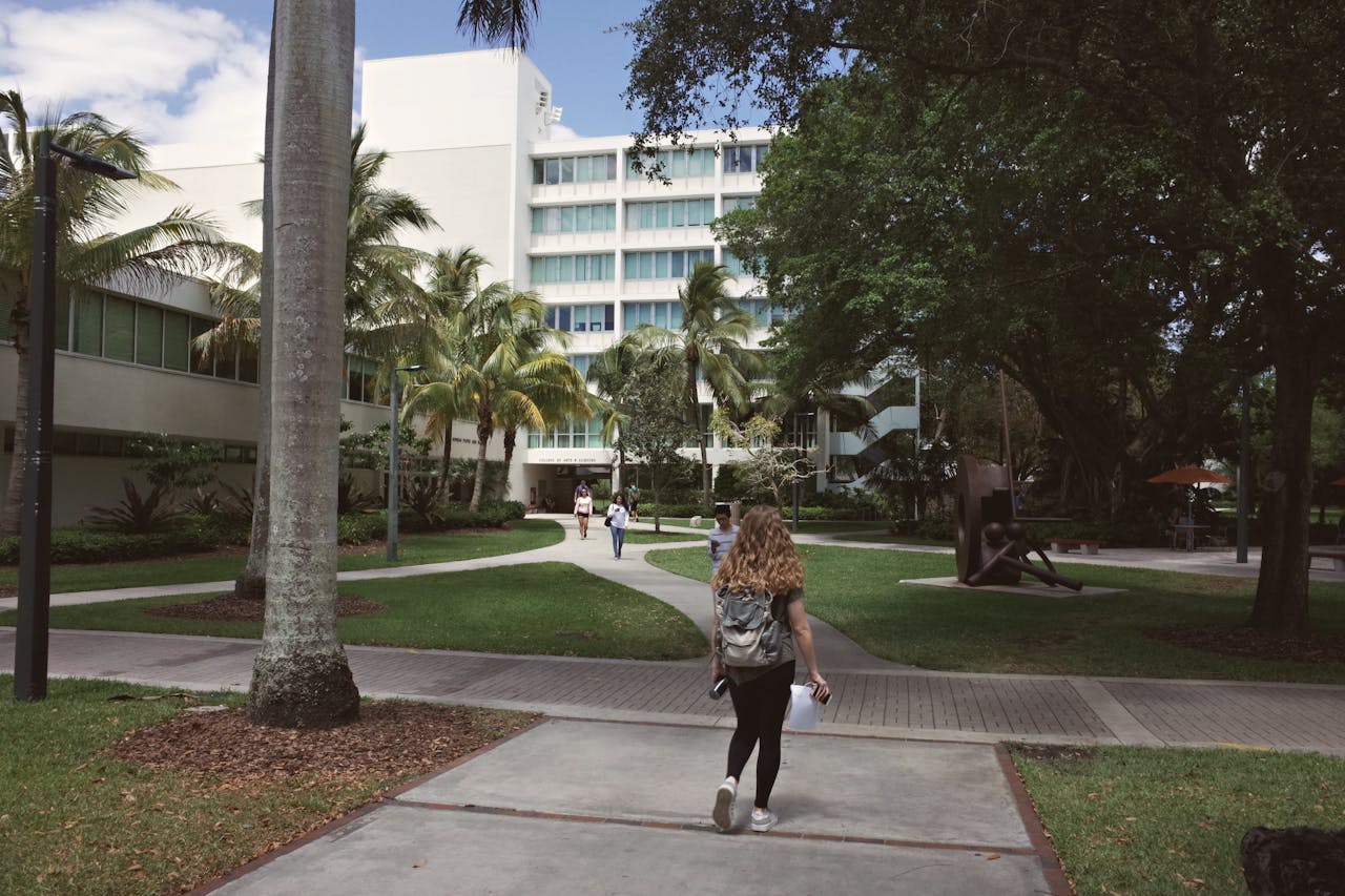A vibrant university campus scene in Coral Gables, Florida showcasing college life on a sunny day.